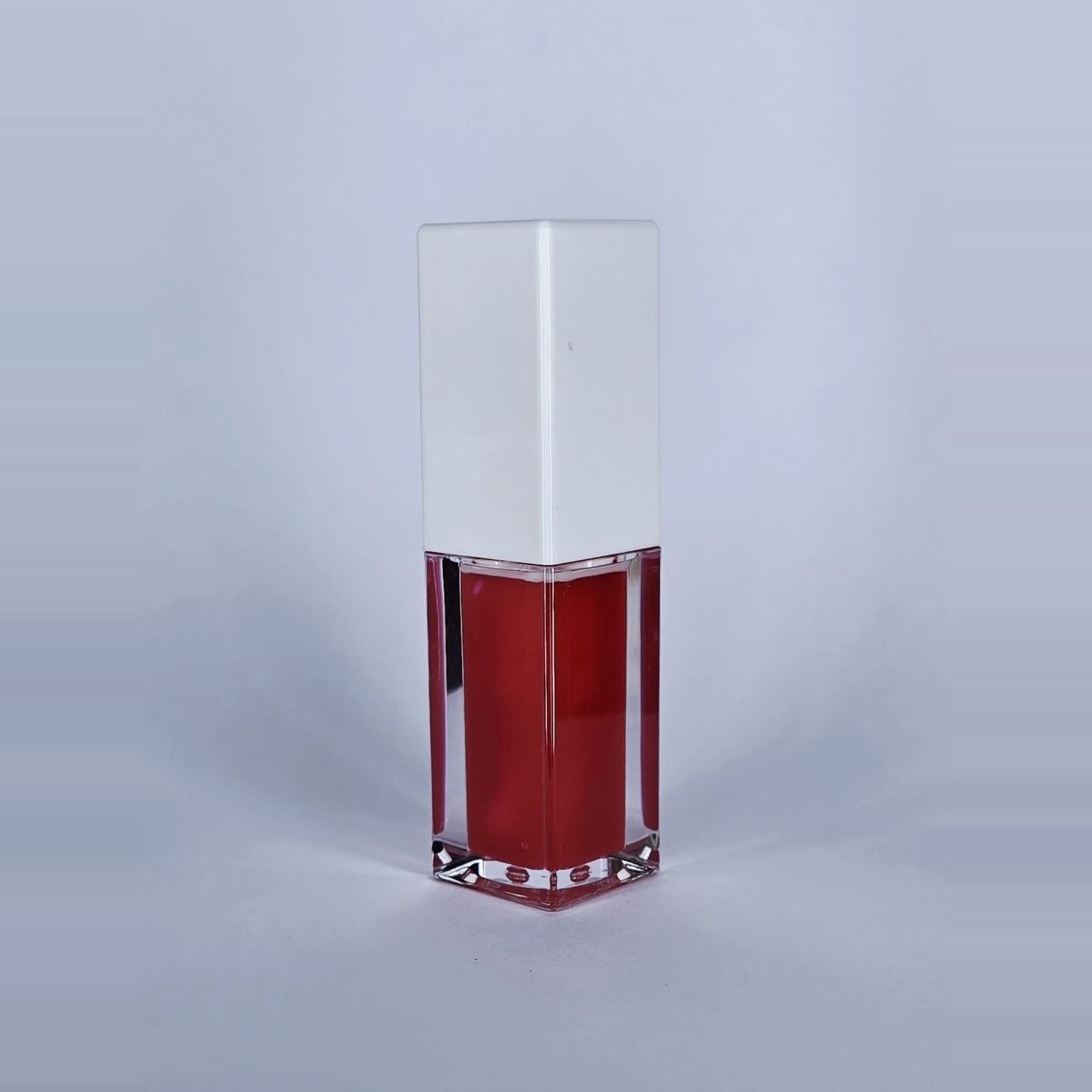 Love red lip gloss, side view
